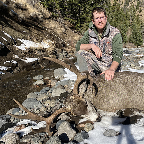 Justin Phillips with a mule deer buck